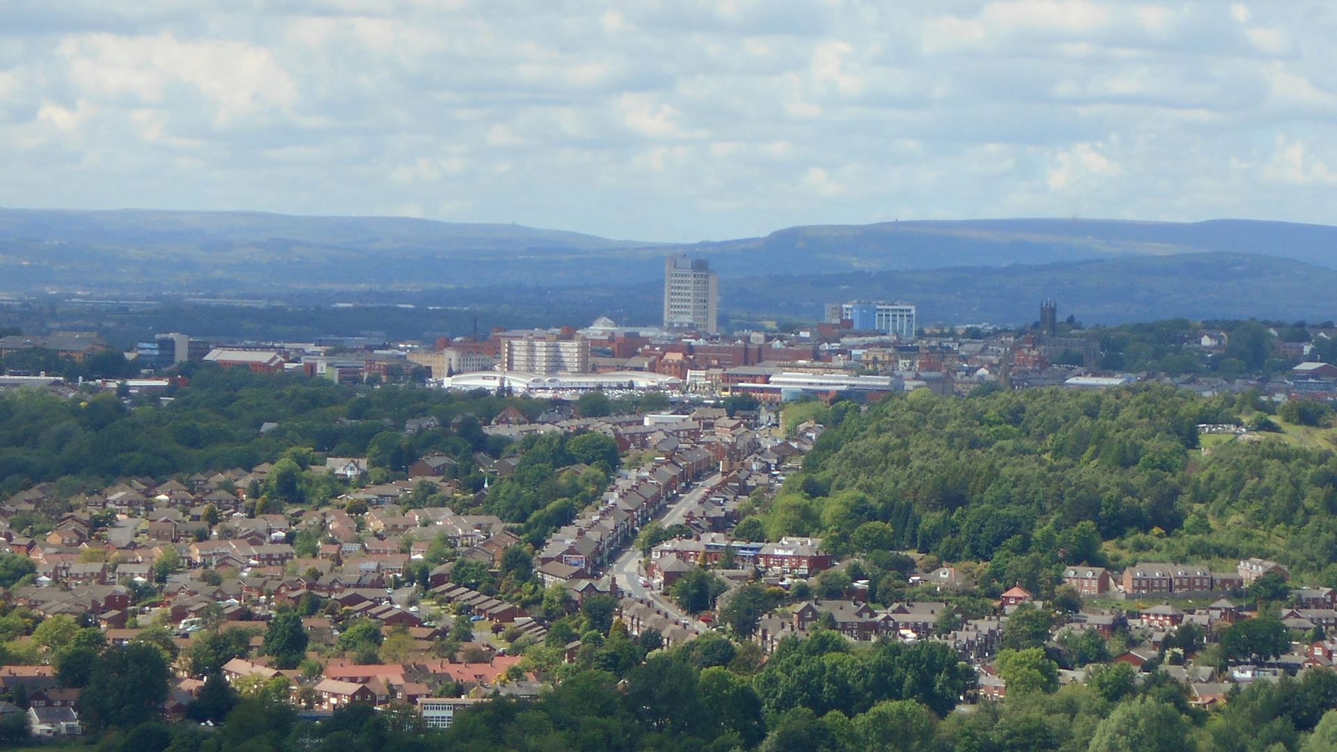 View over Oldham town centre towards the hills